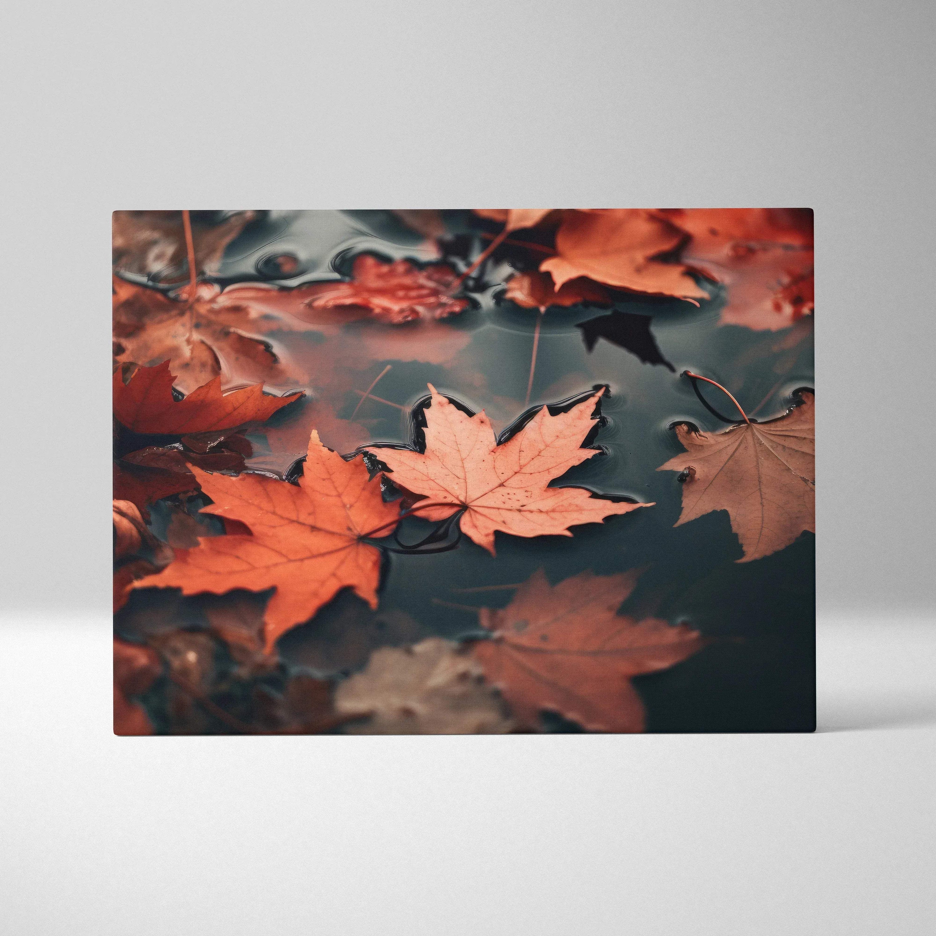 Autumn leaves in rich orange and brown floating on water canvas wall art with serene natural tones.