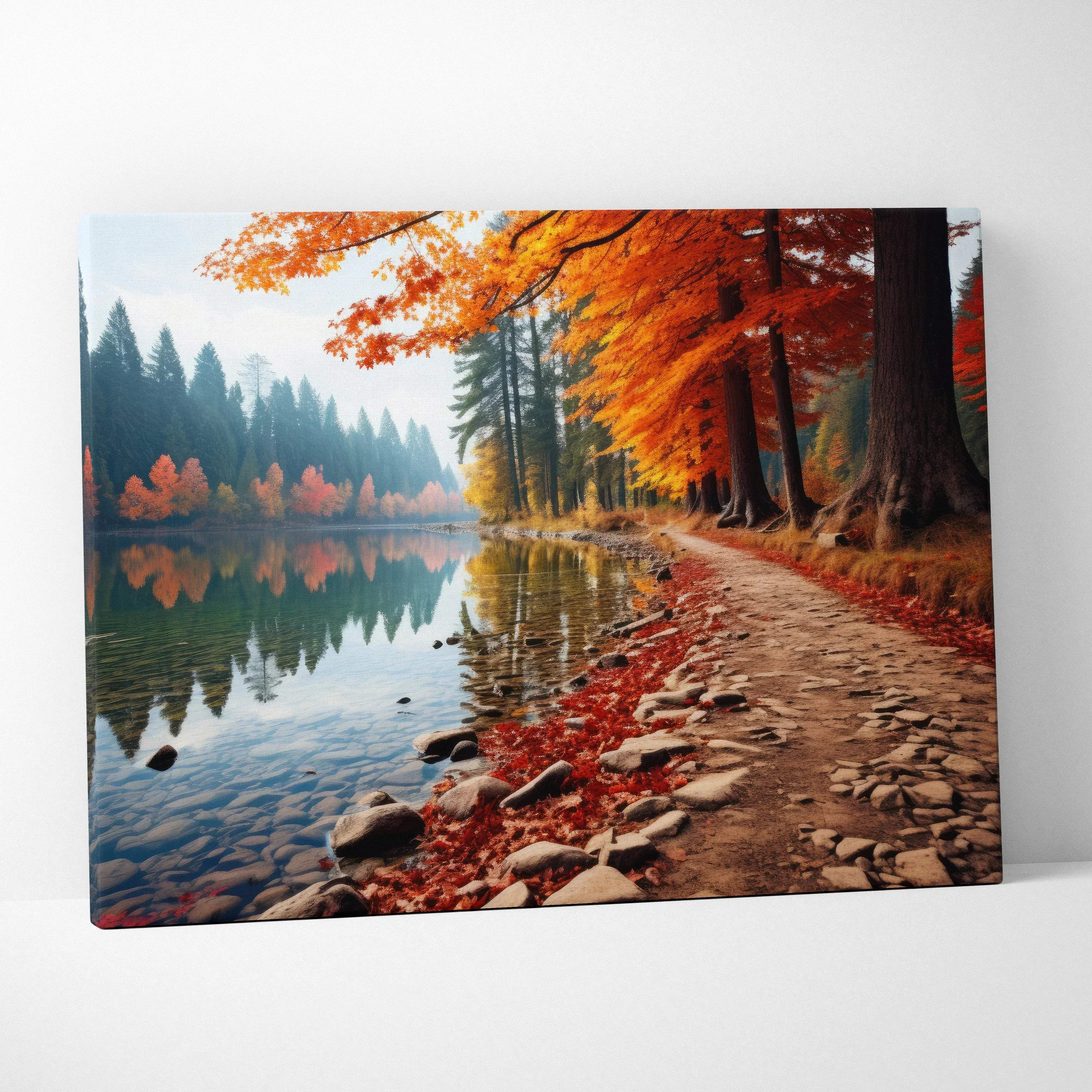 A rectangular canvas wall art of an autumn forest path by lake with vibrant red orange and gold leaves reflecting calm water