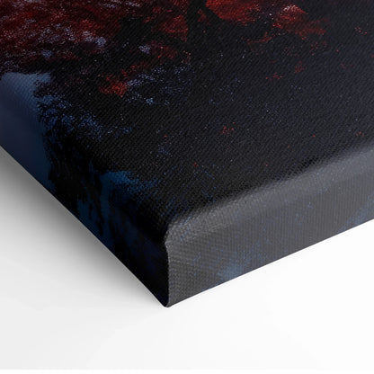 Close-up of vibrant autumn landscape canvas wall art with rich red and dark blue tones on textured canvas.