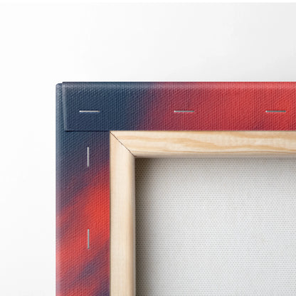 Corner of wooden framed canvas wall art showing vibrant red and navy gradient digital autumn landscape print.
