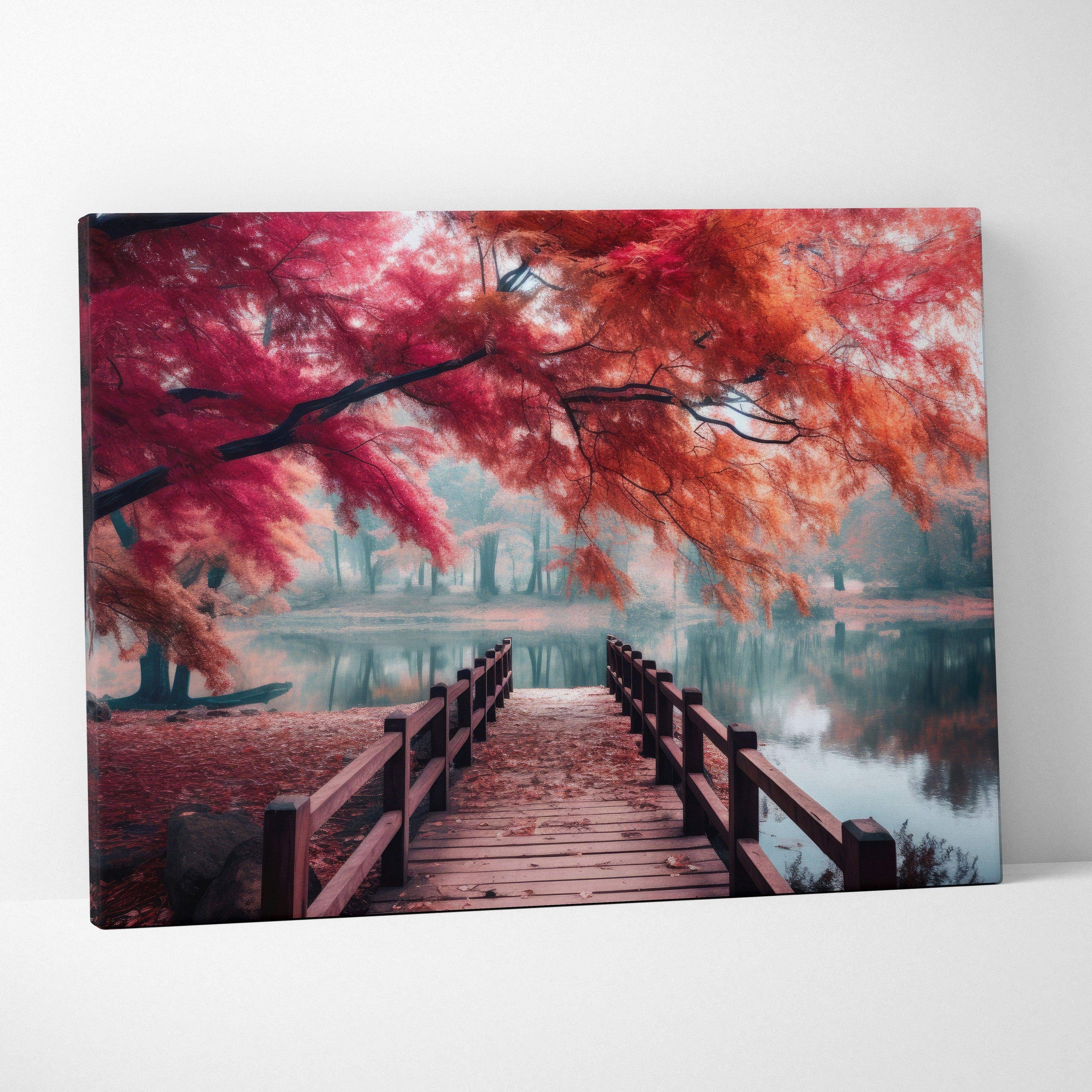 Canvas wall art featuring vibrant red and orange autumn leaves over a wooden bridge and misty lake scene.