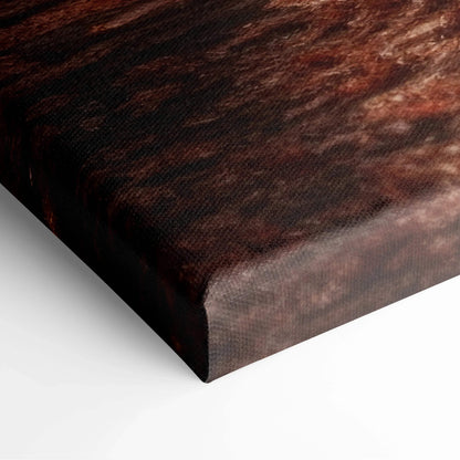 Close-up of canvas art corner with rich dark autumn tones and textured woven surface.