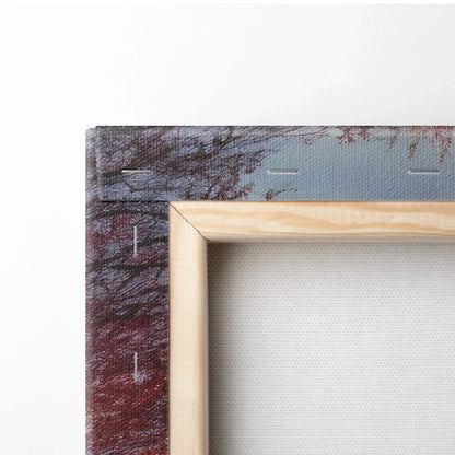 Close-up of wooden frame and canvas texture on vibrant autumn sunset wall art with red and gold foliage.
