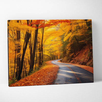 Autumn canvas art featuring a winding road through vibrant fall foliage wall art in warm orange and yellow tones.
