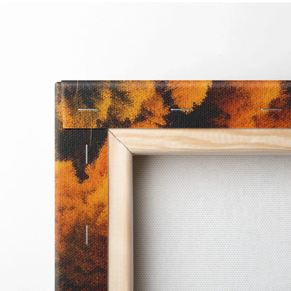 Close-up of wooden frame corner with autumn leaf design on stretched canvas wall art.