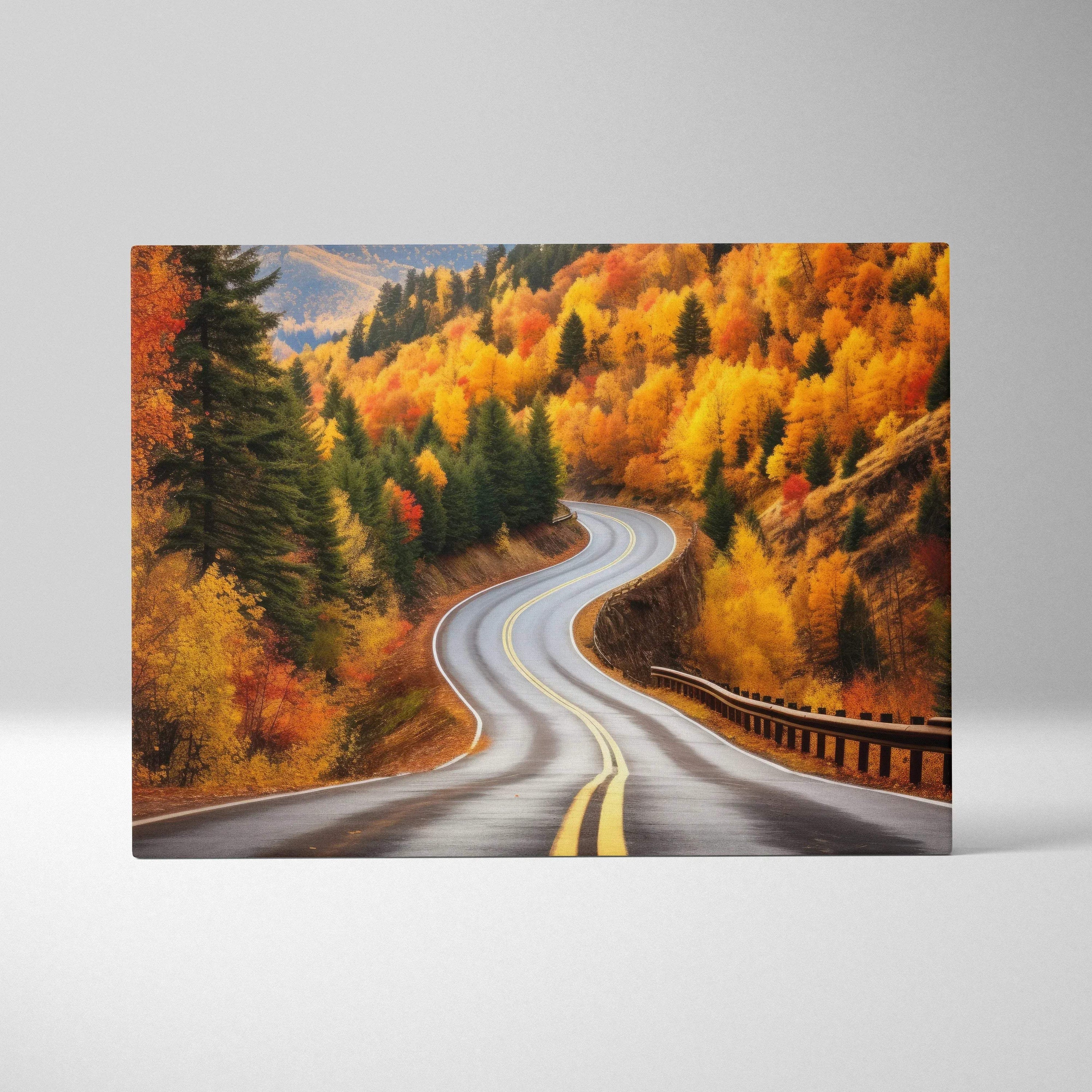 Autumn landscape canvas art featuring winding road surrounded by golden and orange leaves wall art.