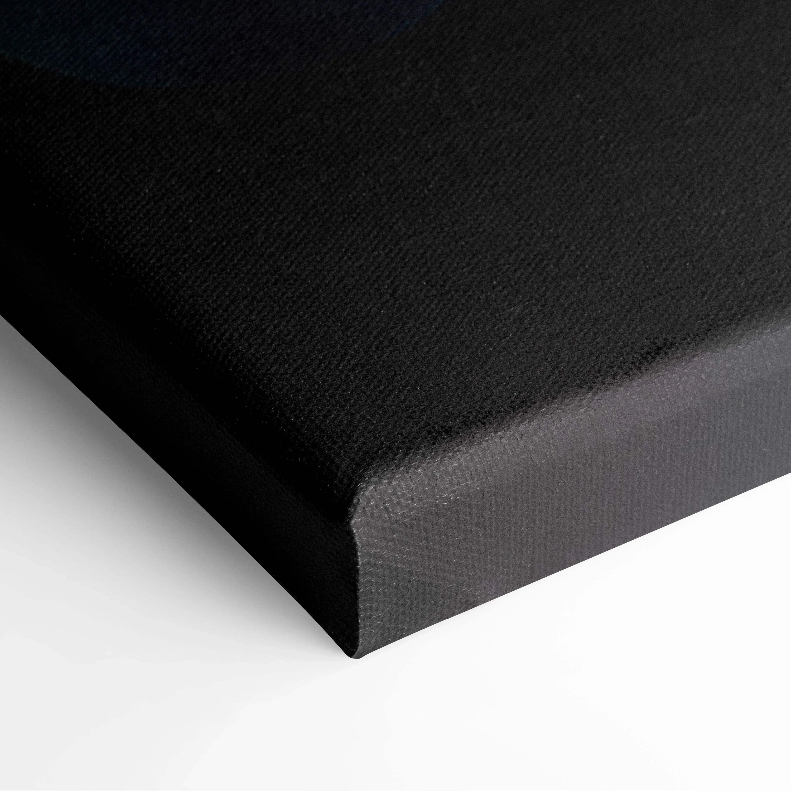 Black stretched canvas art corner with tight, smooth fabric texture for wall art display.