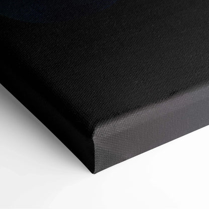 Black stretched canvas art corner with tight, smooth fabric texture for wall art display.
