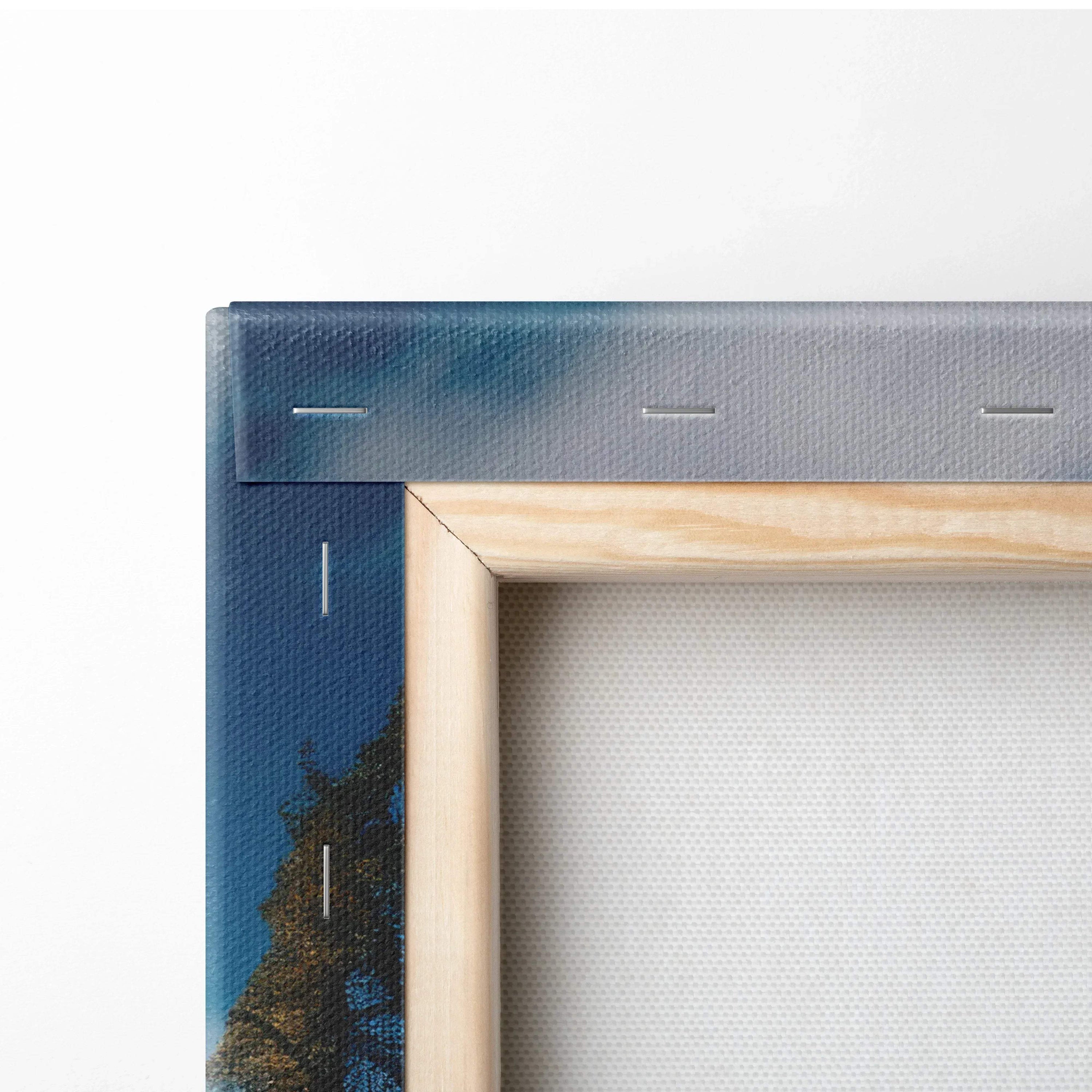 Close-up of framed digital art canvas with vibrant blue and autumn foliage on textured wall art canvas.