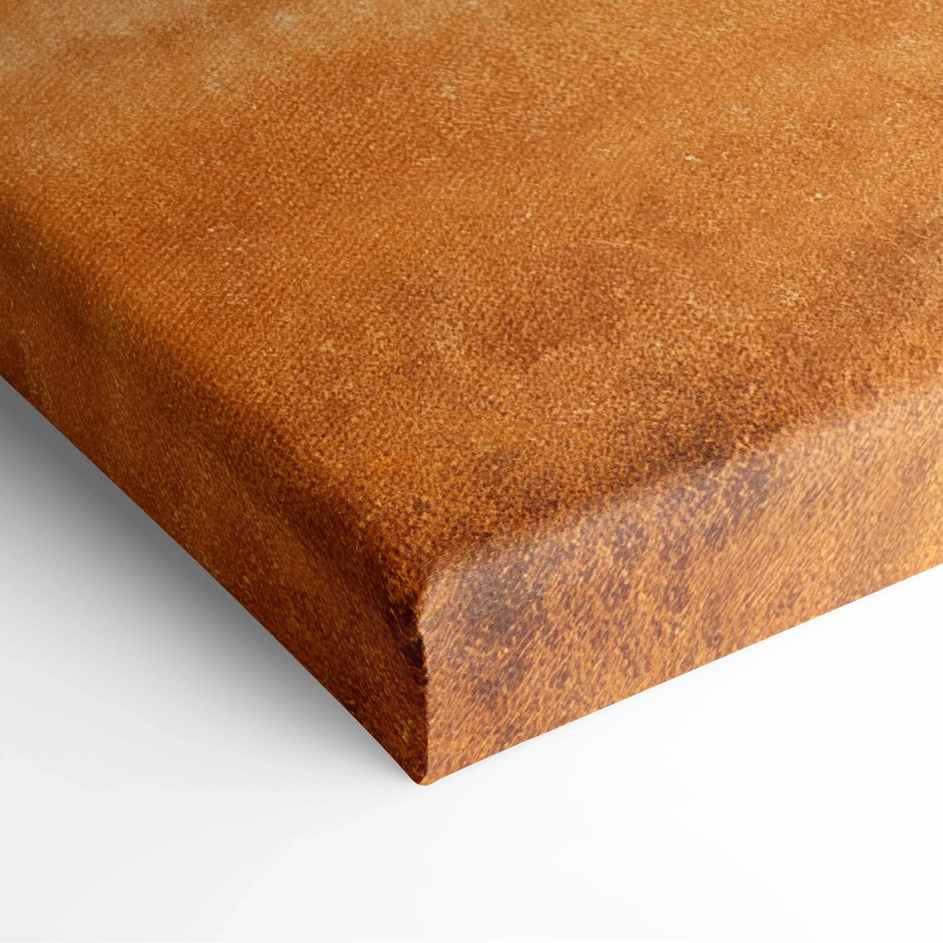 Close-up of brown textured canvas art edge with rich earthy tones for wall decor.