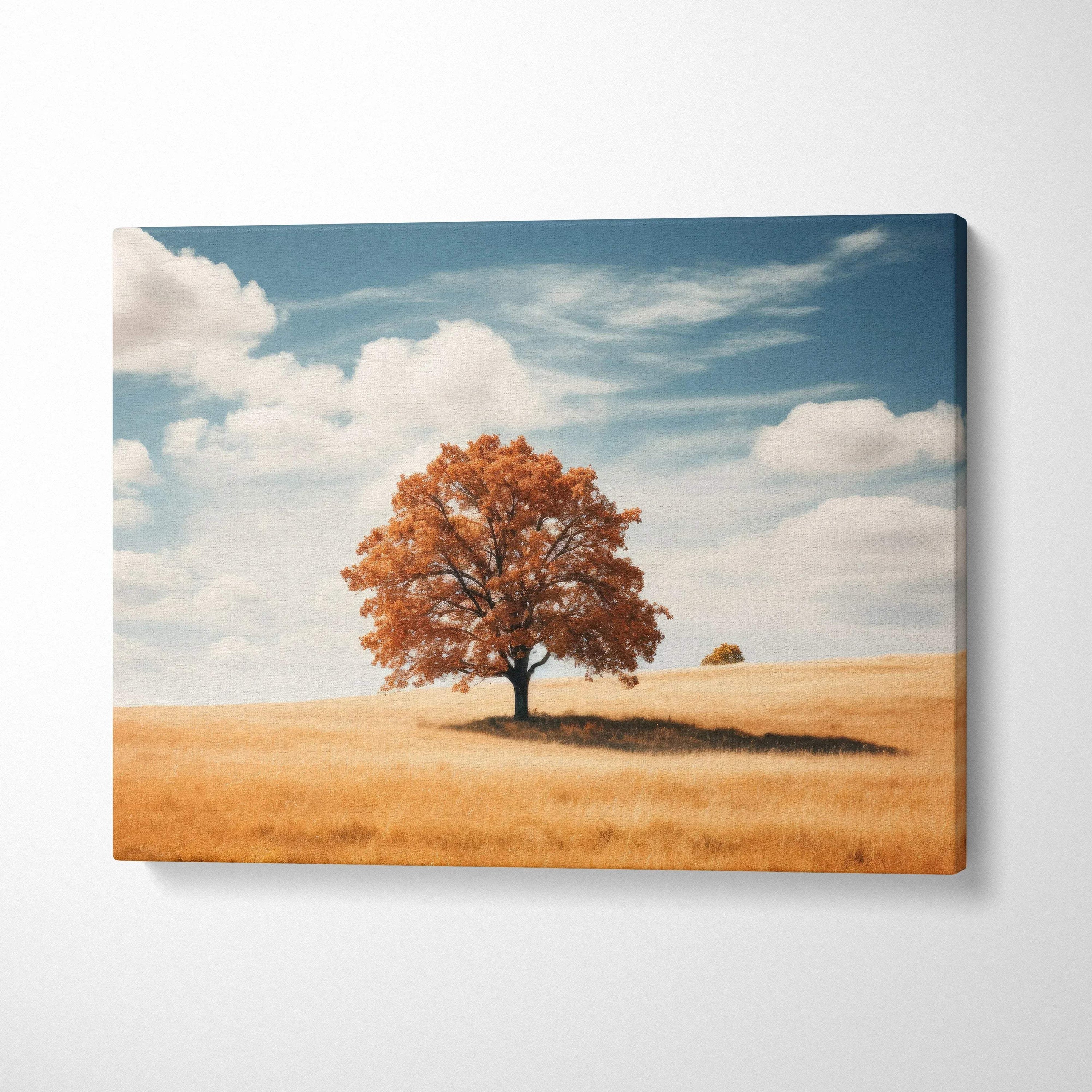Canvas wall art featuring vibrant autumn foliage on a solitary tree in a golden field under a blue sky.