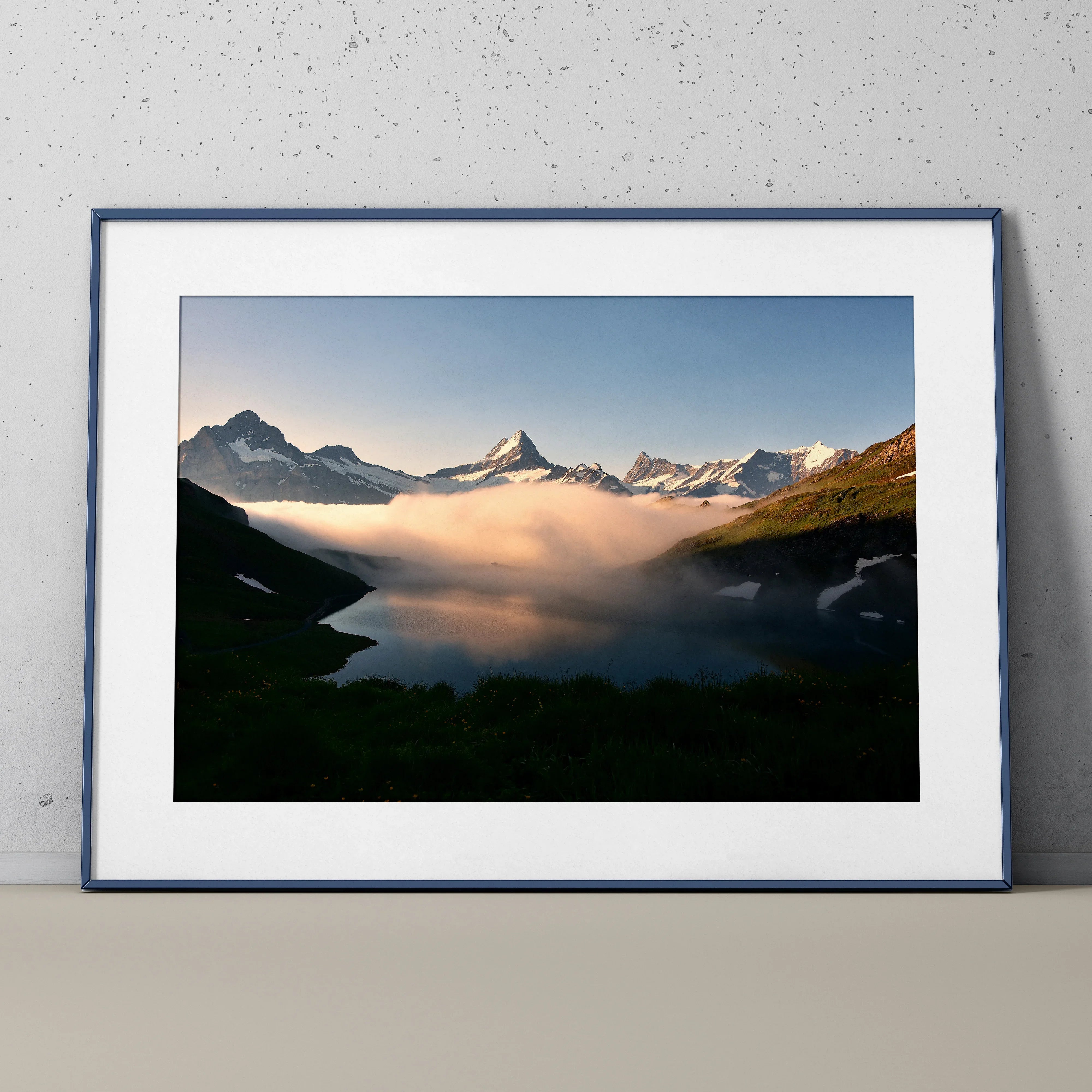 Mountain landscape poster with snowy peaks and misty clouds, framed wall art print.