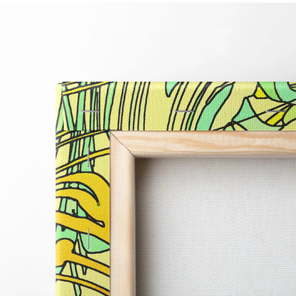 Vibrant yellow green tropical leaf canvas art in light wood frame