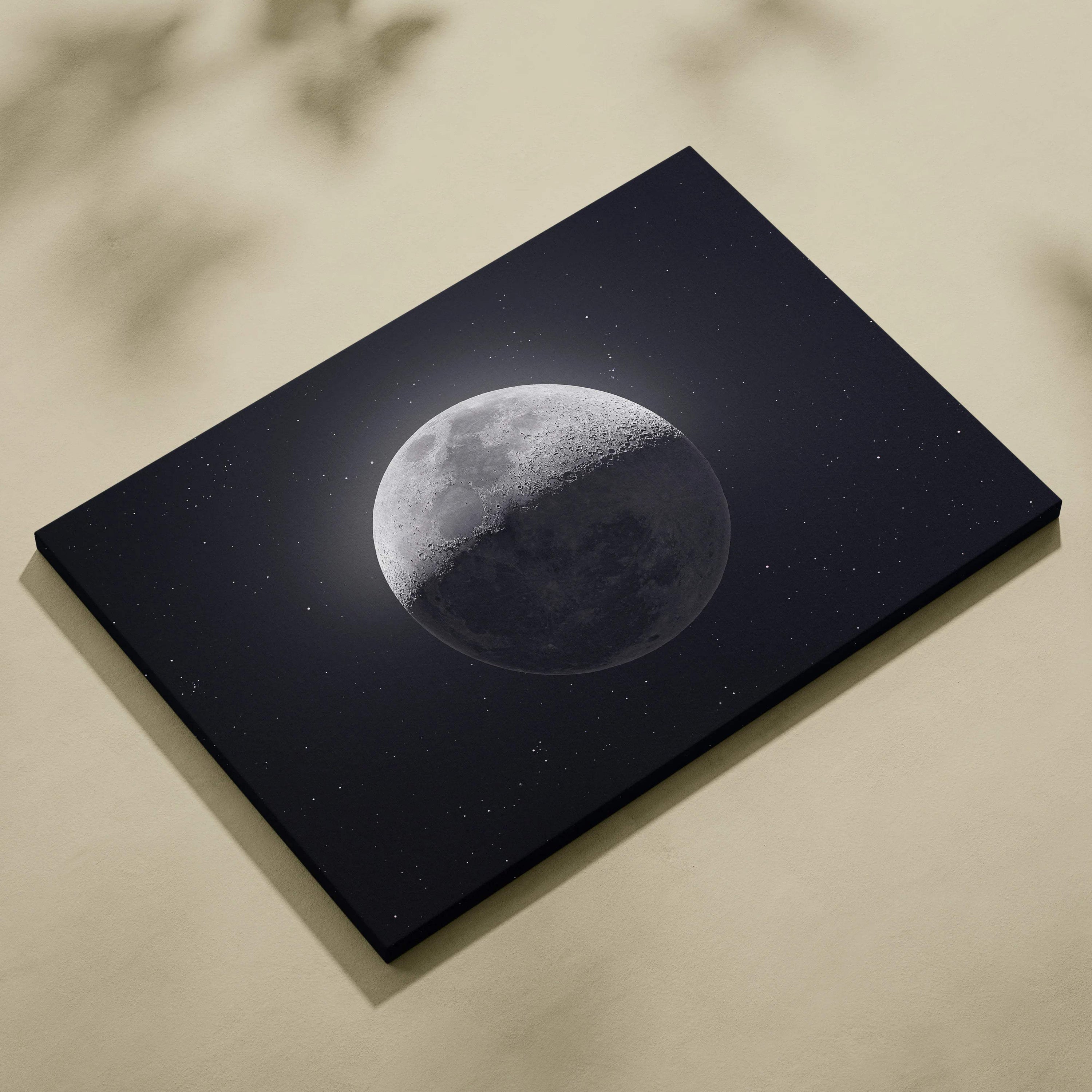 Black canvas print of half-lit moon in starry gray midnight blue sky