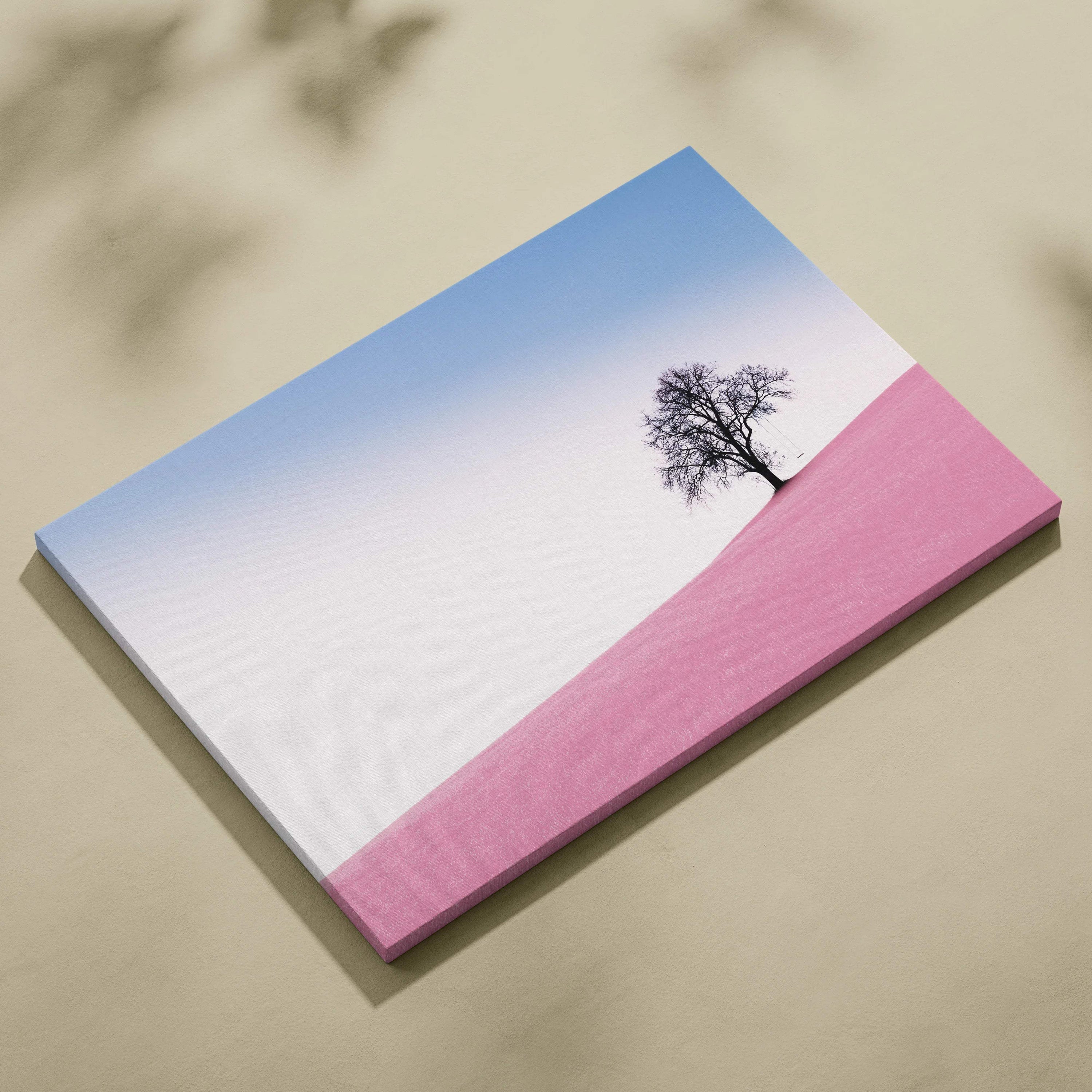 Minimalist canvas print of solitary black tree on pink hill with gradient sky