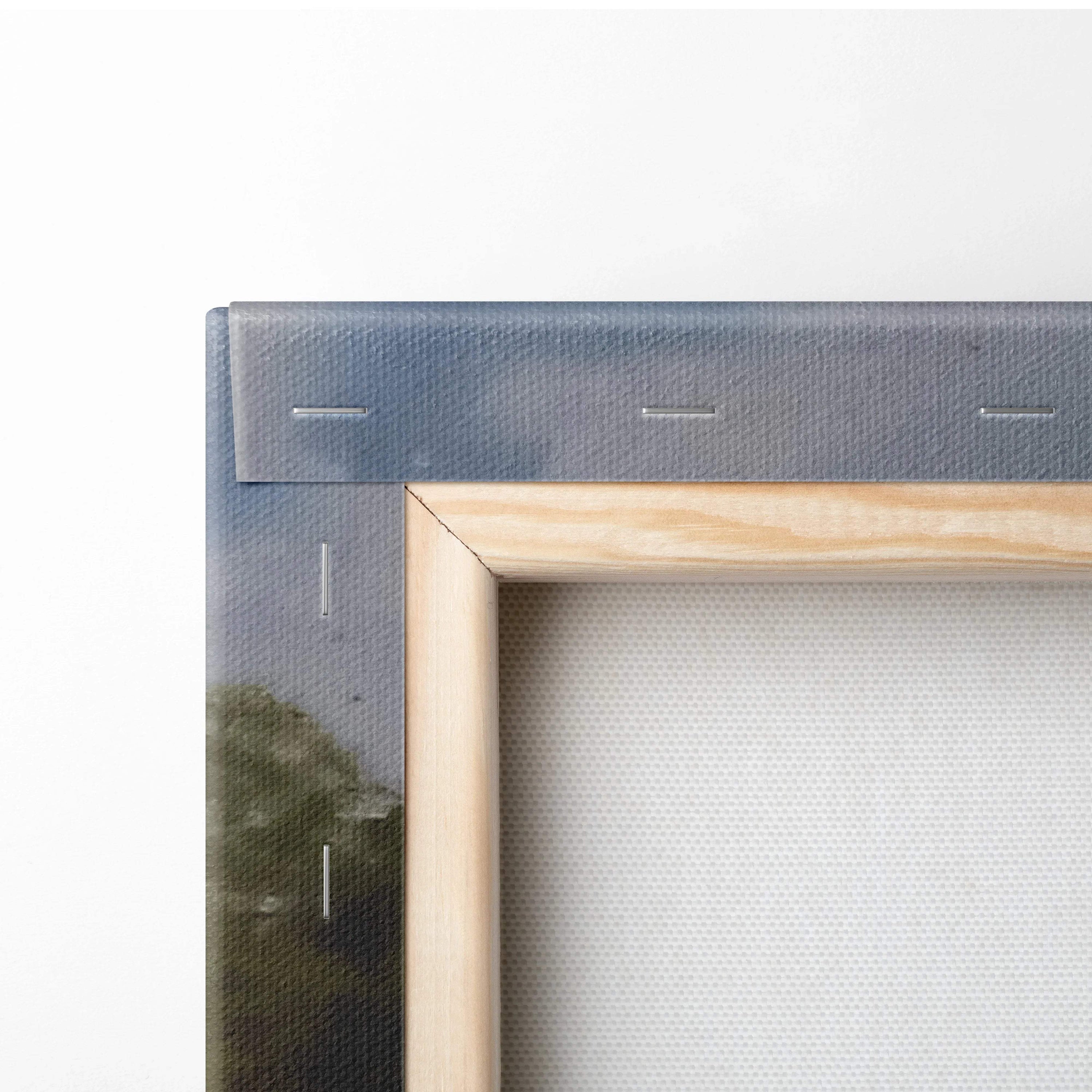 Back of light wood frame with gray canvas border and stitching on rustic countryside cottage painting