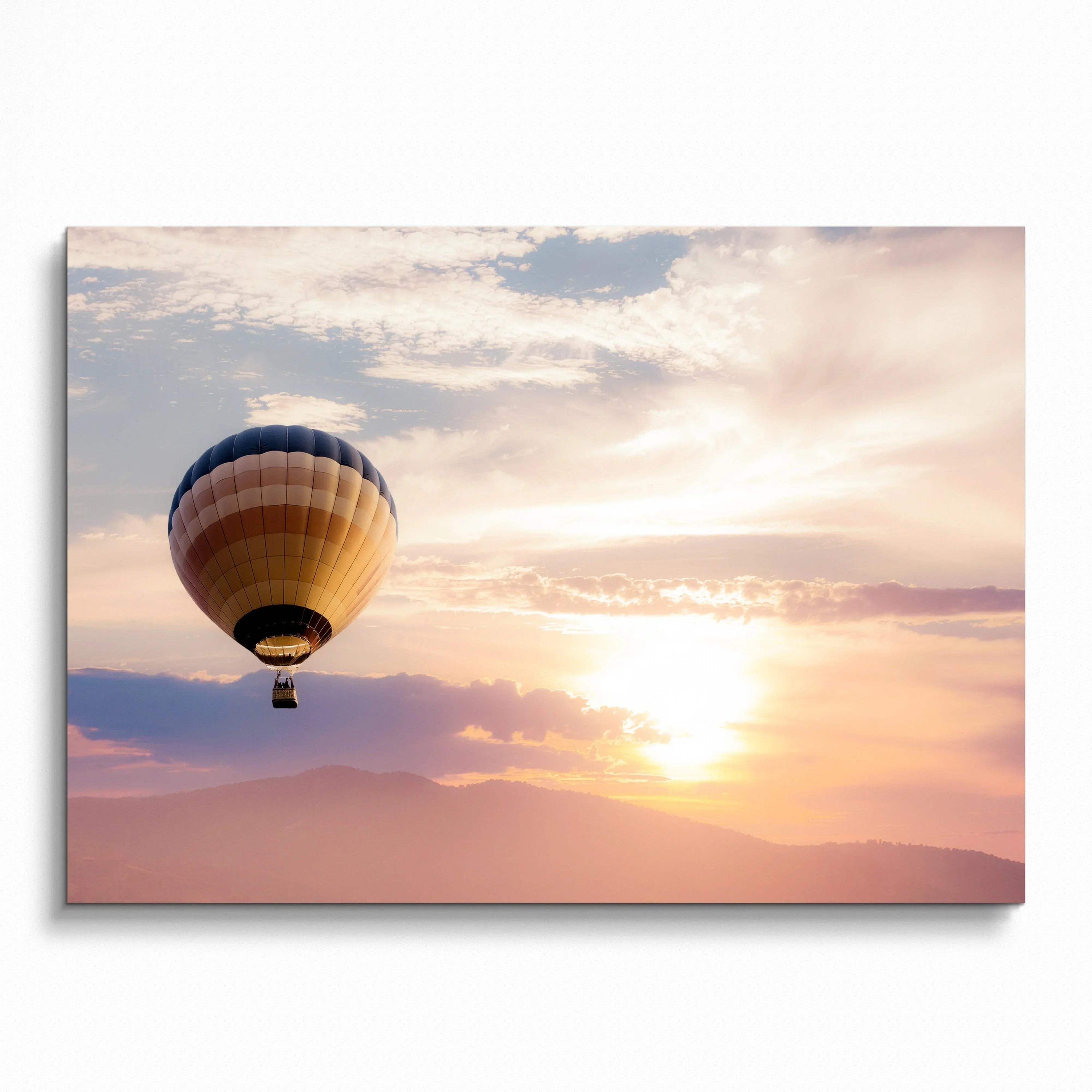 Sunset wall art poster featuring a hot air balloon floating over soft pastel clouds and mountains.