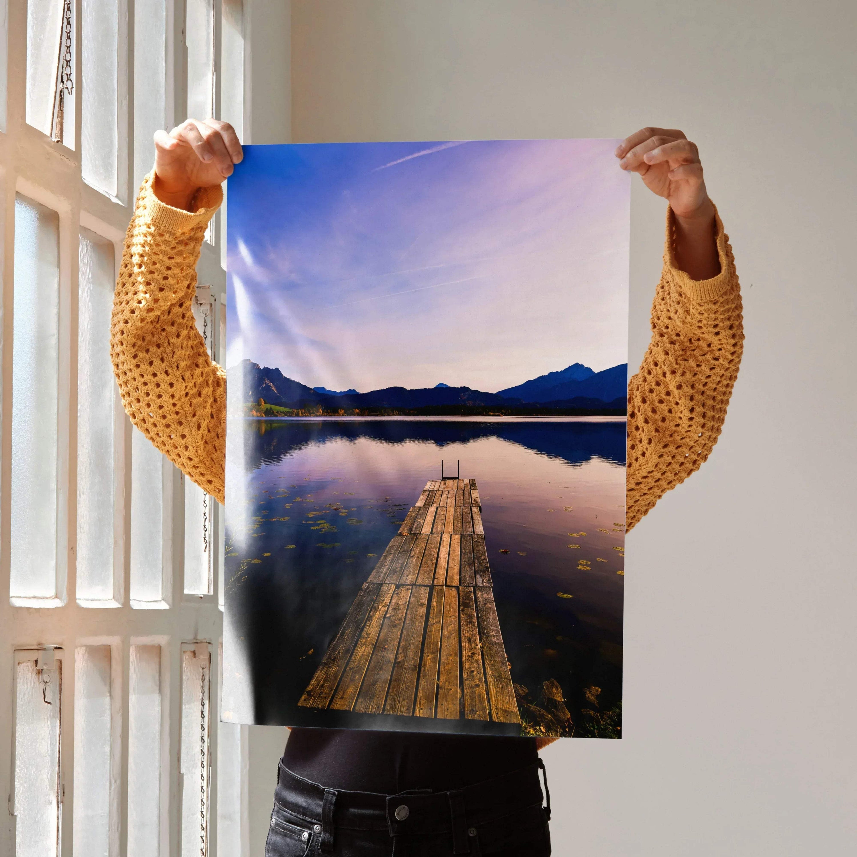 Vertical wall art poster featuring a wooden dock leading to mountains at sunset with vibrant sky colors.
