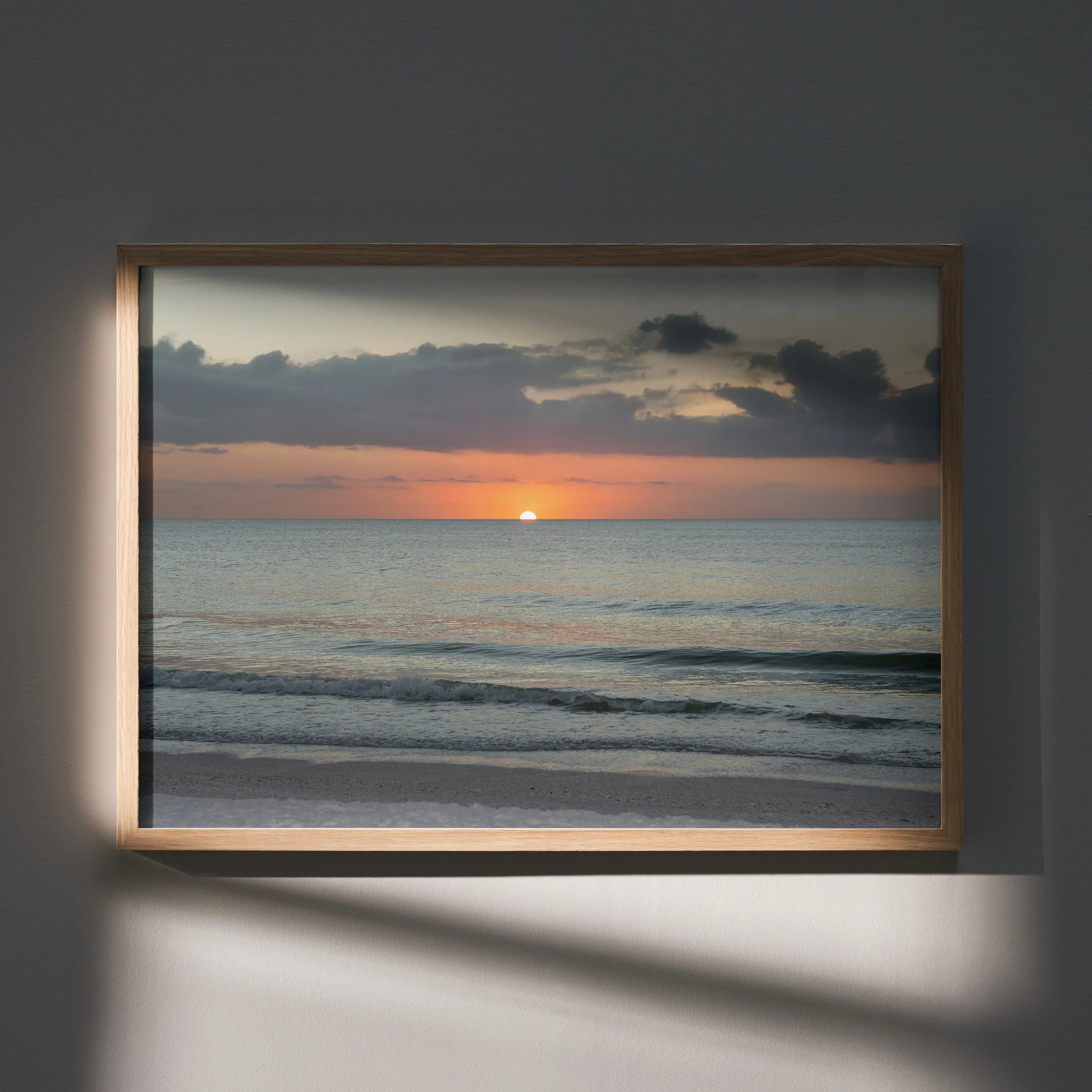 Beach sunset poster with calm ocean waves and soft clouds, wall art in wooden frame.
