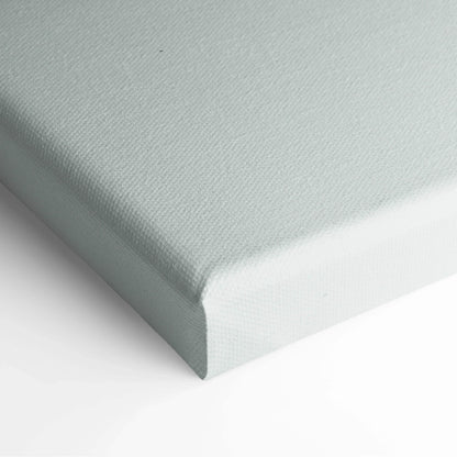 Close-up of blank light gray canvas stretched over wooden frame for wall art display.