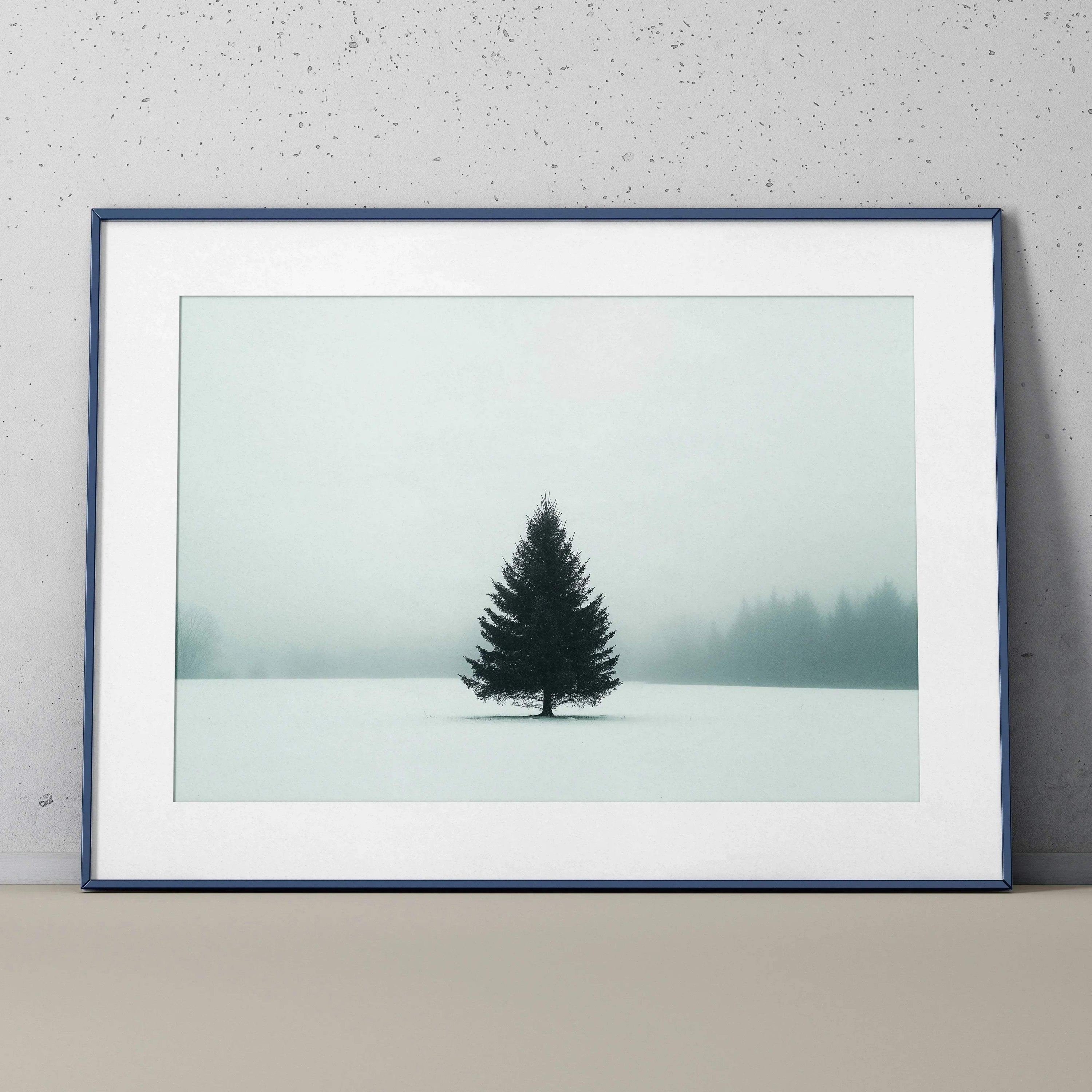 Minimalist snow landscape wall art poster featuring a solitary pine tree in a foggy snowy field.