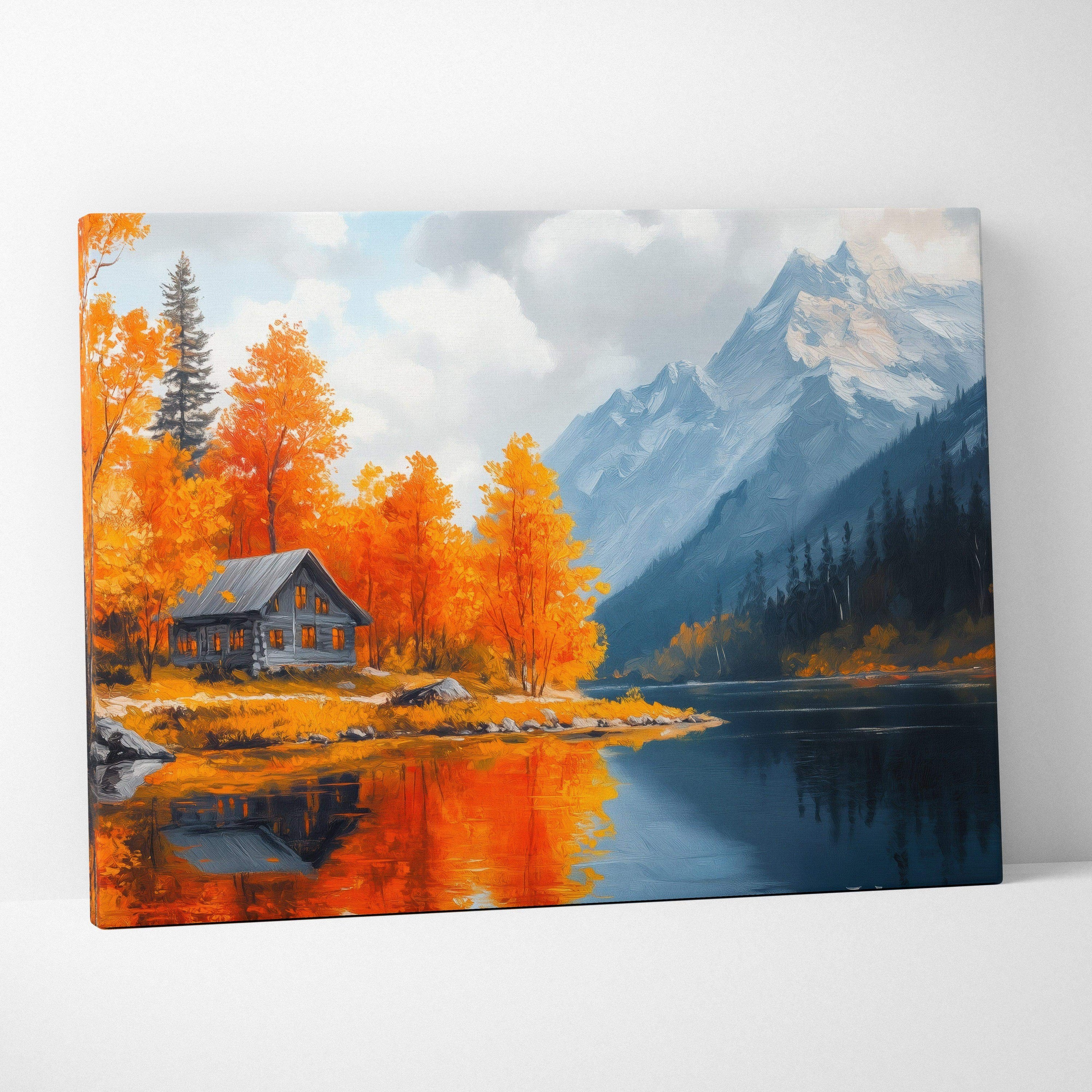 Canvas wall art of vibrant autumn trees by a lake with a cabin and mountain backdrop.