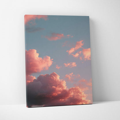 Canvas wall art featuring vibrant sunset clouds in a colorful sky with pink and orange hues.