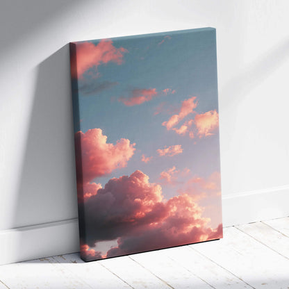 Canvas wall art featuring vibrant sunset clouds in warm pink and orange hues against a soft blue sky.