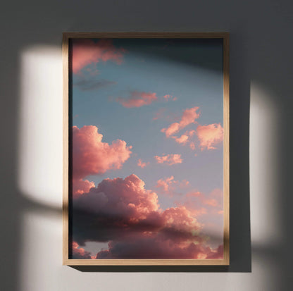 Vertical sunset sky poster with vibrant pink clouds against a blue backdrop, wall art print.