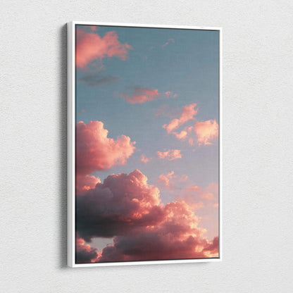 Vertical canvas wall art featuring vibrant pink and orange clouds at sunset against a blue sky.