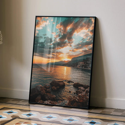 Vertical beach sunset poster with vibrant orange sky and rocky shoreline wall art.