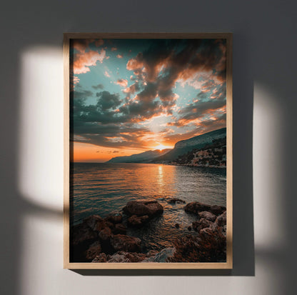 Vertical beach sunset poster with rocky shore and colorful sky, serene nature wall art.