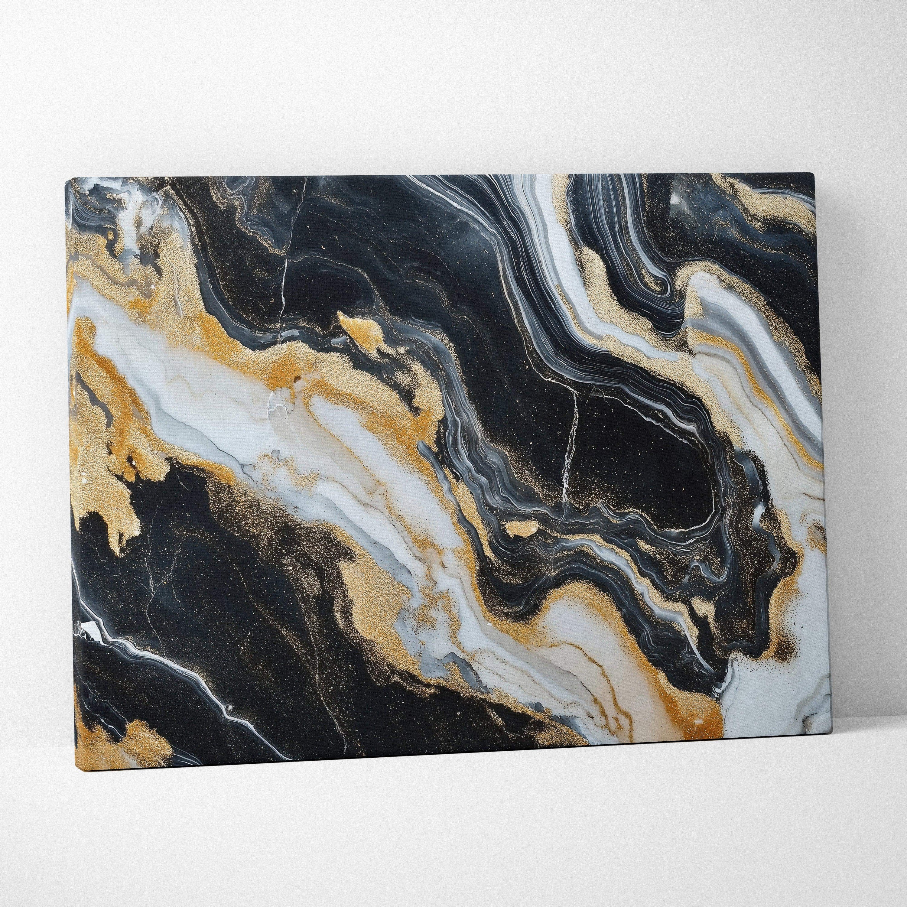 Abstract canvas wall art with swirling black, white, and gold marble patterns.