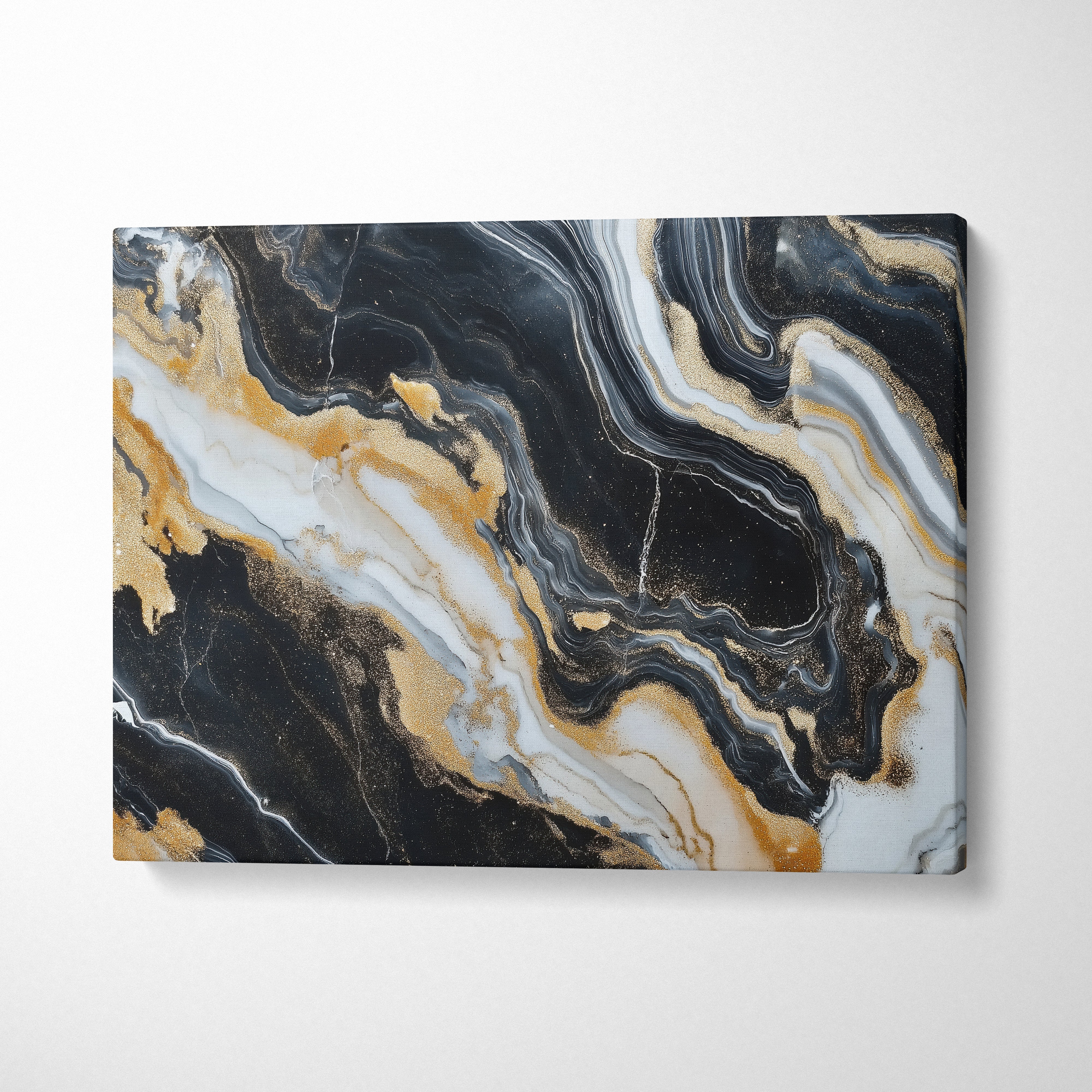 Abstract canvas wall art with swirling black, white, and gold marble-like patterns.