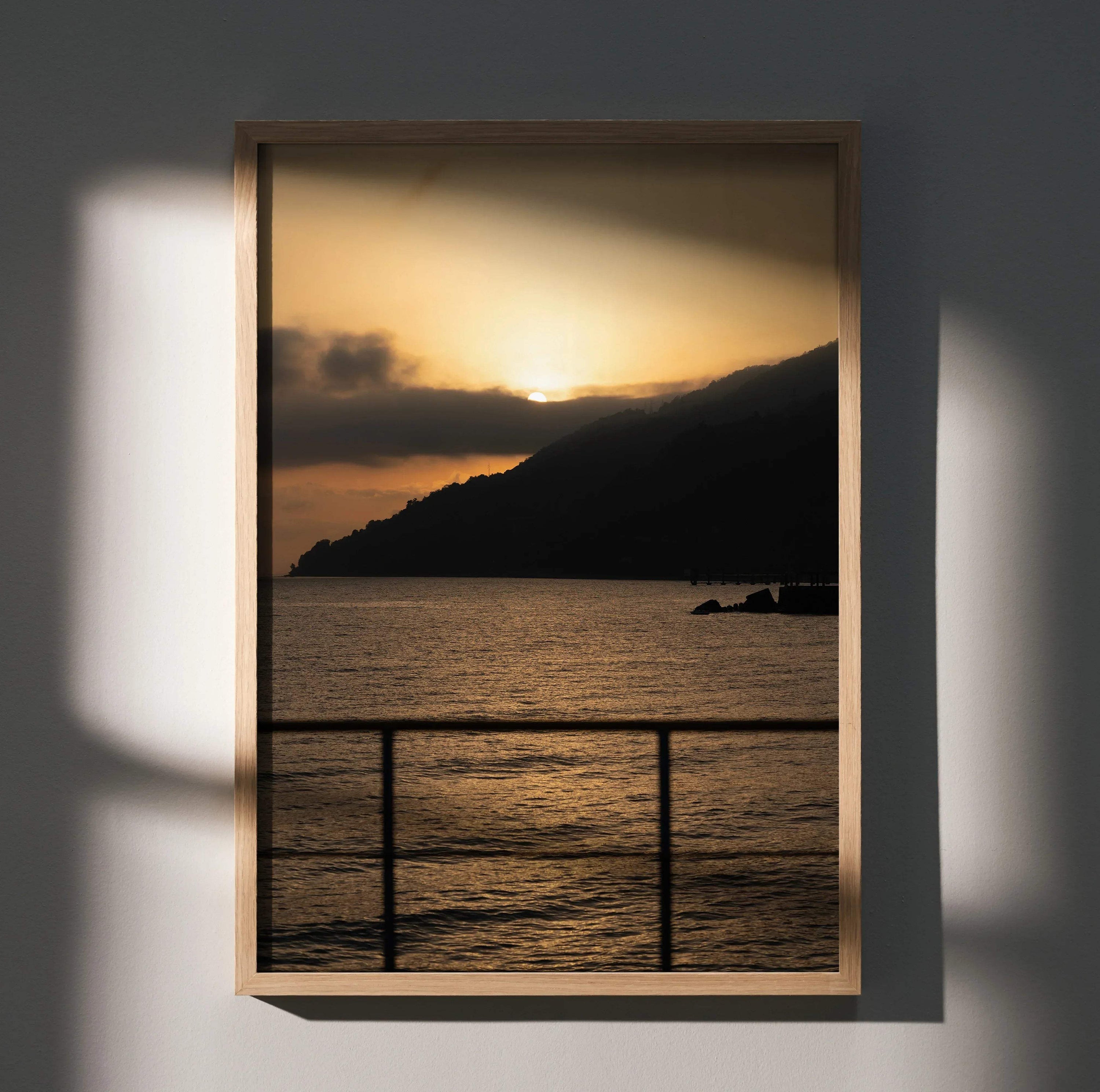 Vertical beach sunset poster with golden sky, silhouetted mountain, and calm water wall art.