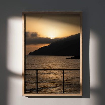Vertical beach sunset poster with golden sky, silhouetted mountain, and calm water wall art.