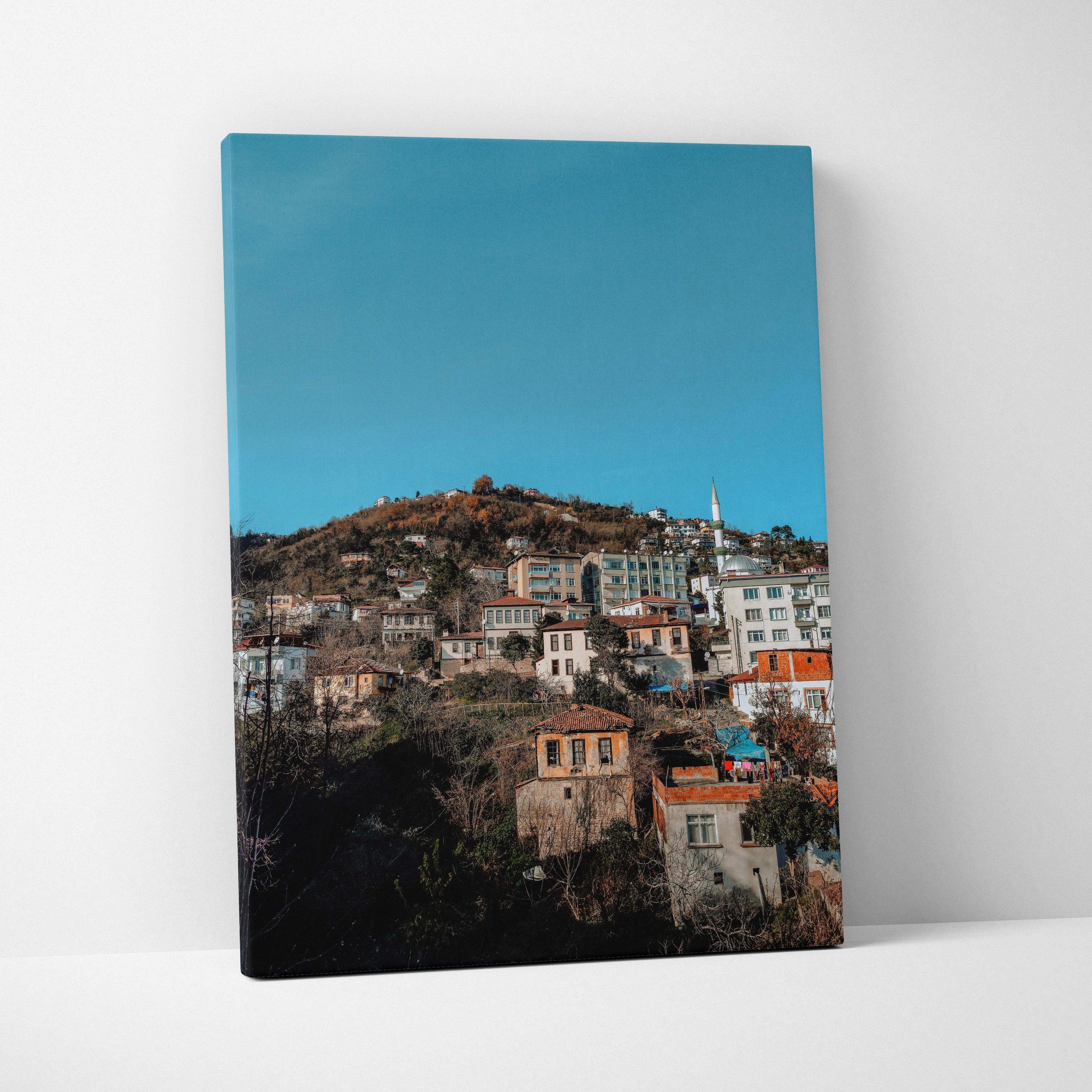 Vibrant urban cityscape canvas wall art with colorful buildings under clear blue sky.