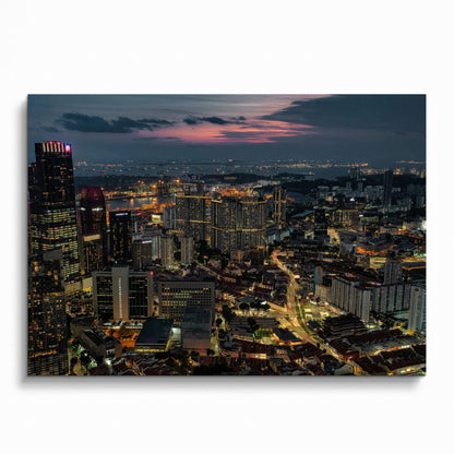 Vibrant city nightscape poster with illuminated buildings and busy streets, wall art showcasing urban lights.