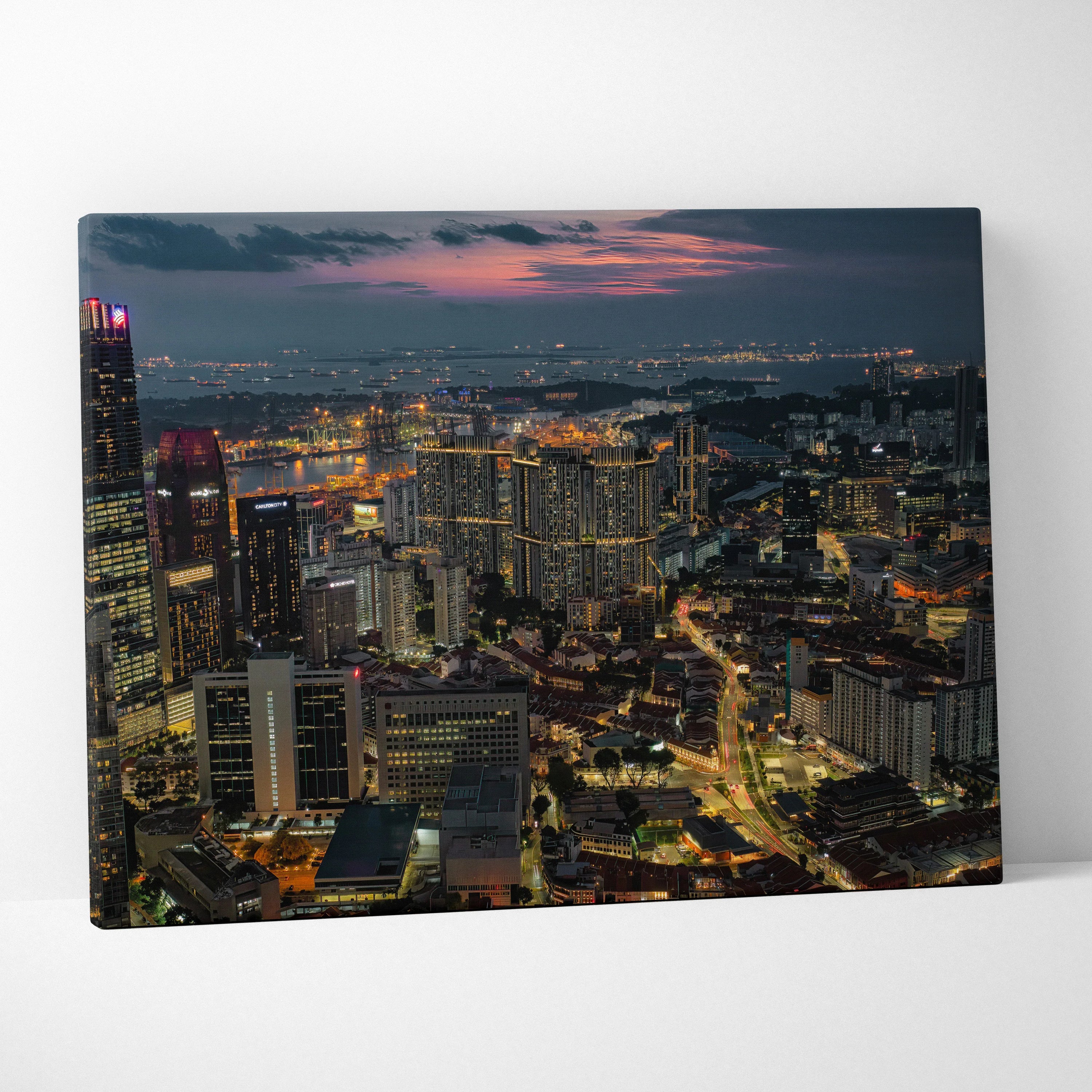 Vibrant city skyline at dusk with illuminated buildings on canvas wall art print.