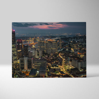Vibrant city skyline at dusk printed on canvas wall art with colorful lights and detailed buildings.