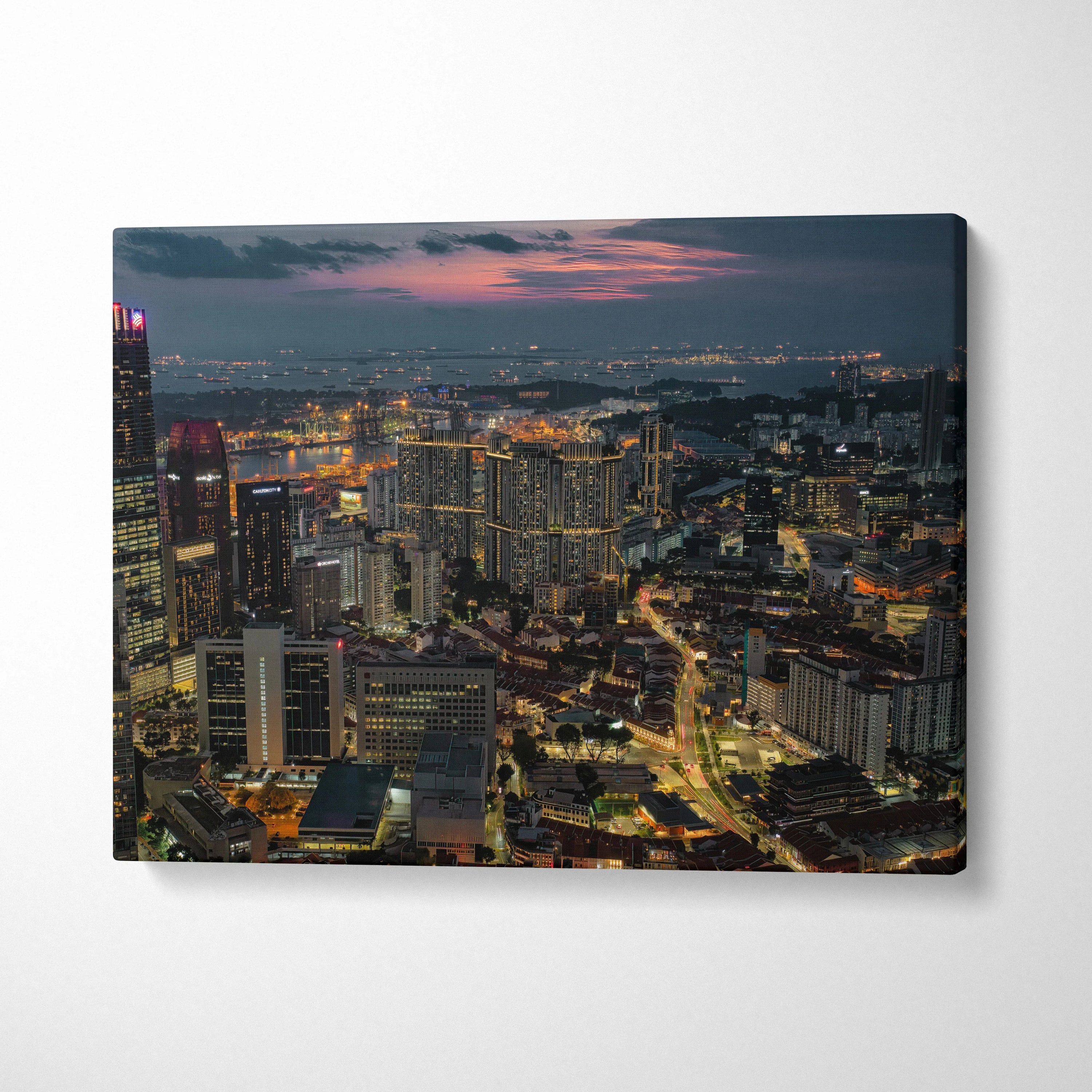 City skyline at dusk with glowing lights on vibrant canvas wall art print.