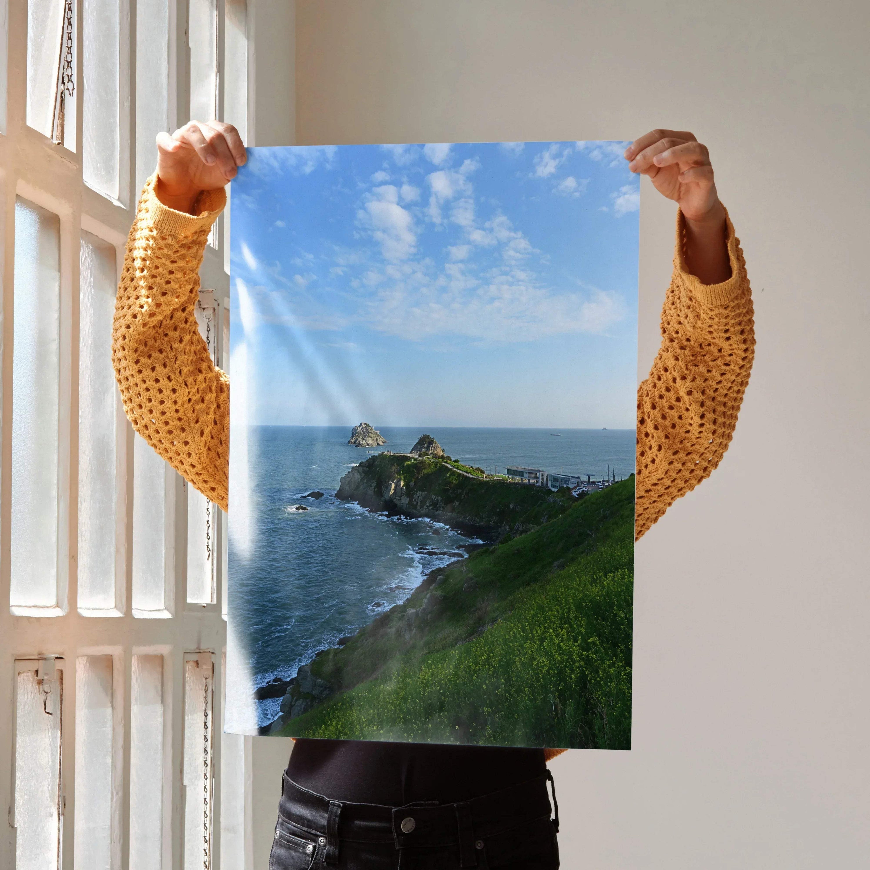 Ocean cliff coastline with waves crashing under blue sky poster for wall art.