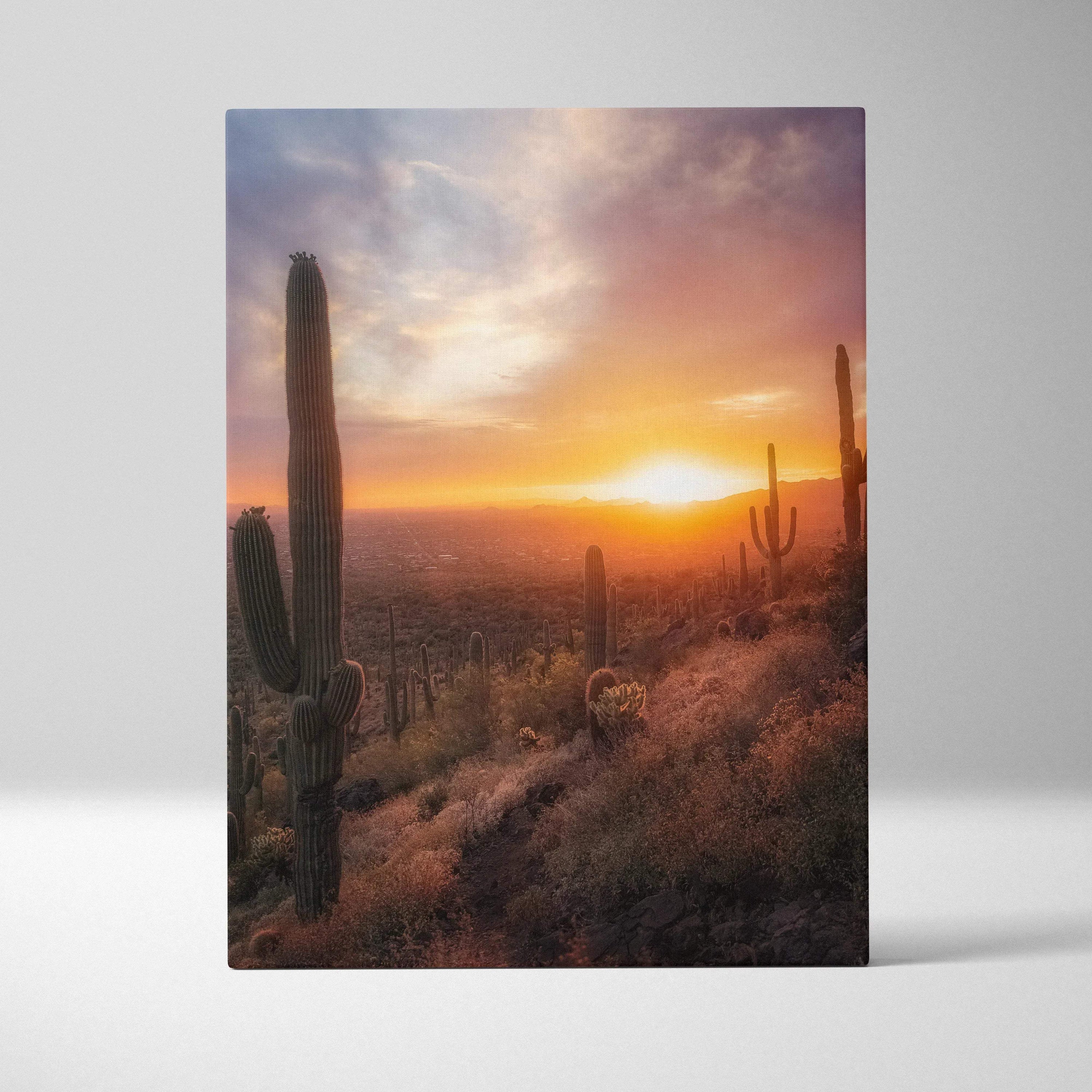 Canvas wall art featuring a vibrant desert sunset with tall cacti and warm orange sky.