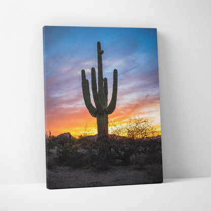 Canvas wall art featuring a desert cactus silhouette against a colorful sunset sky.