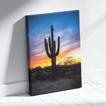 Desert sunset canvas wall art with silhouetted cactus against colorful evening sky.