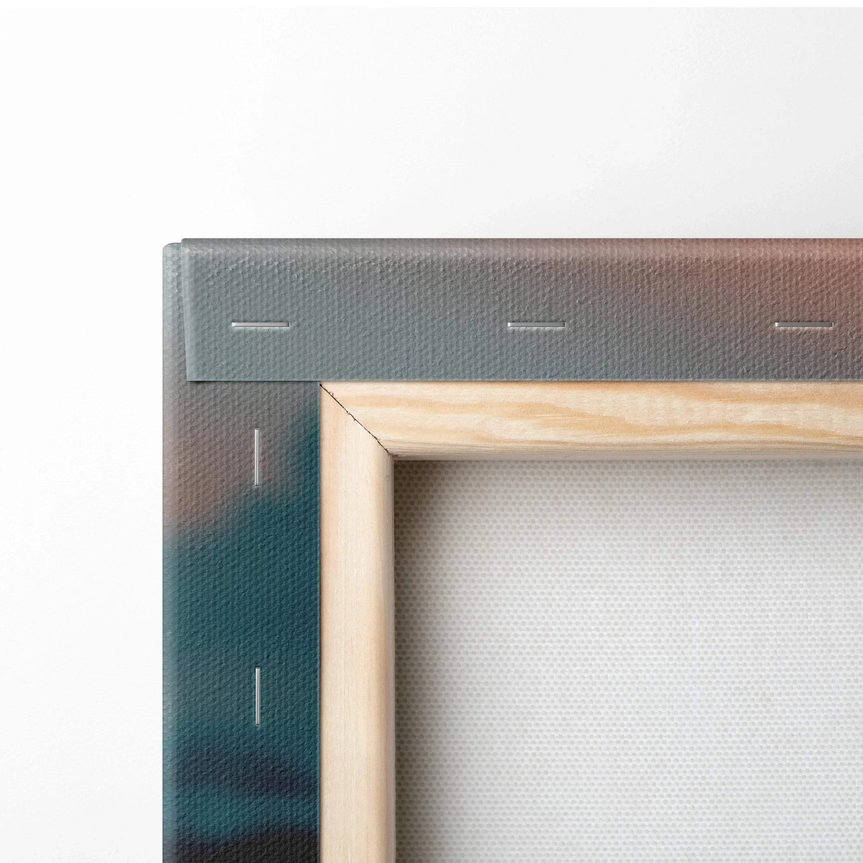 Close-up of canvas corner with wooden frame and visible staples on wall art print.