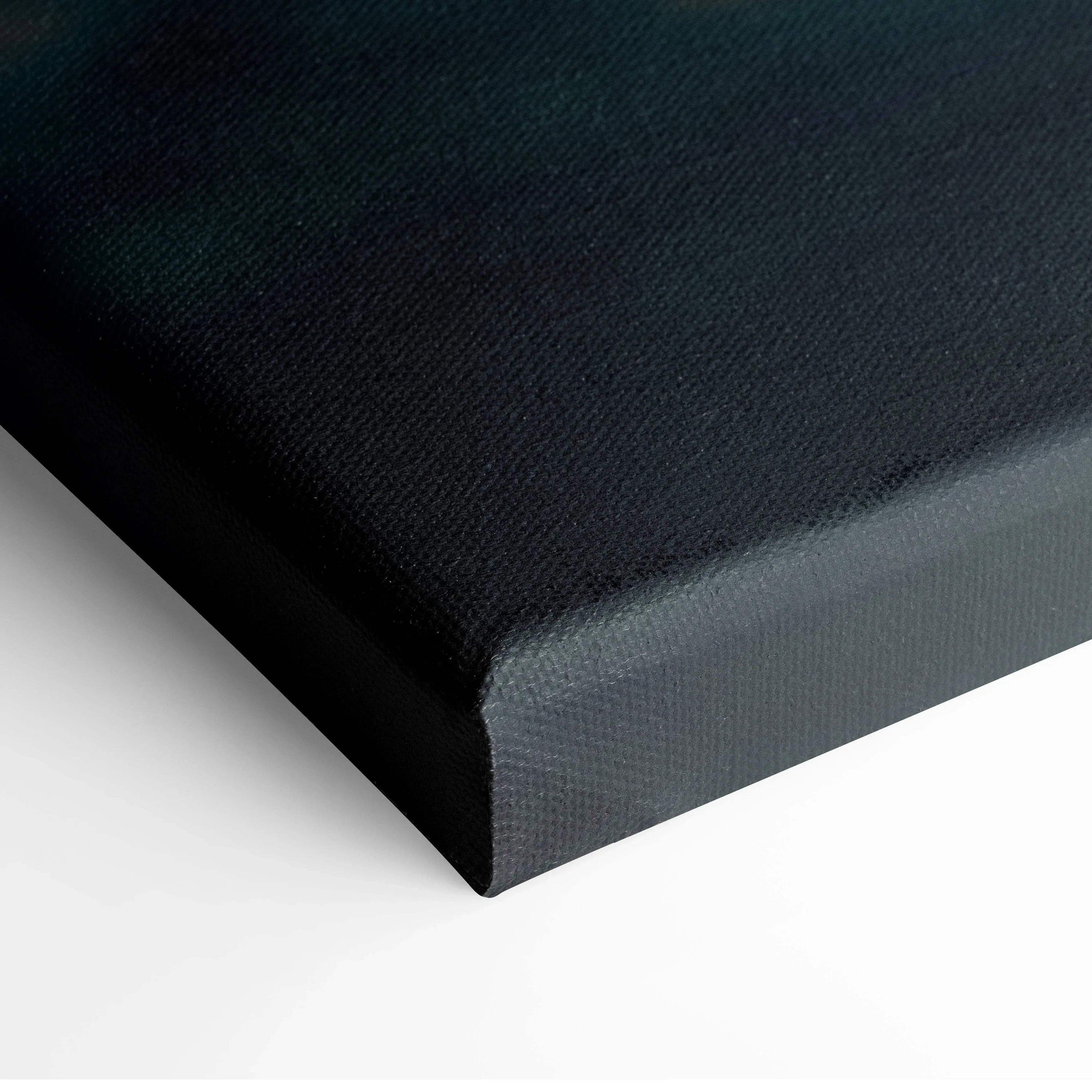 Close-up of black fabric textured canvas wall art corner with wrapped edges.