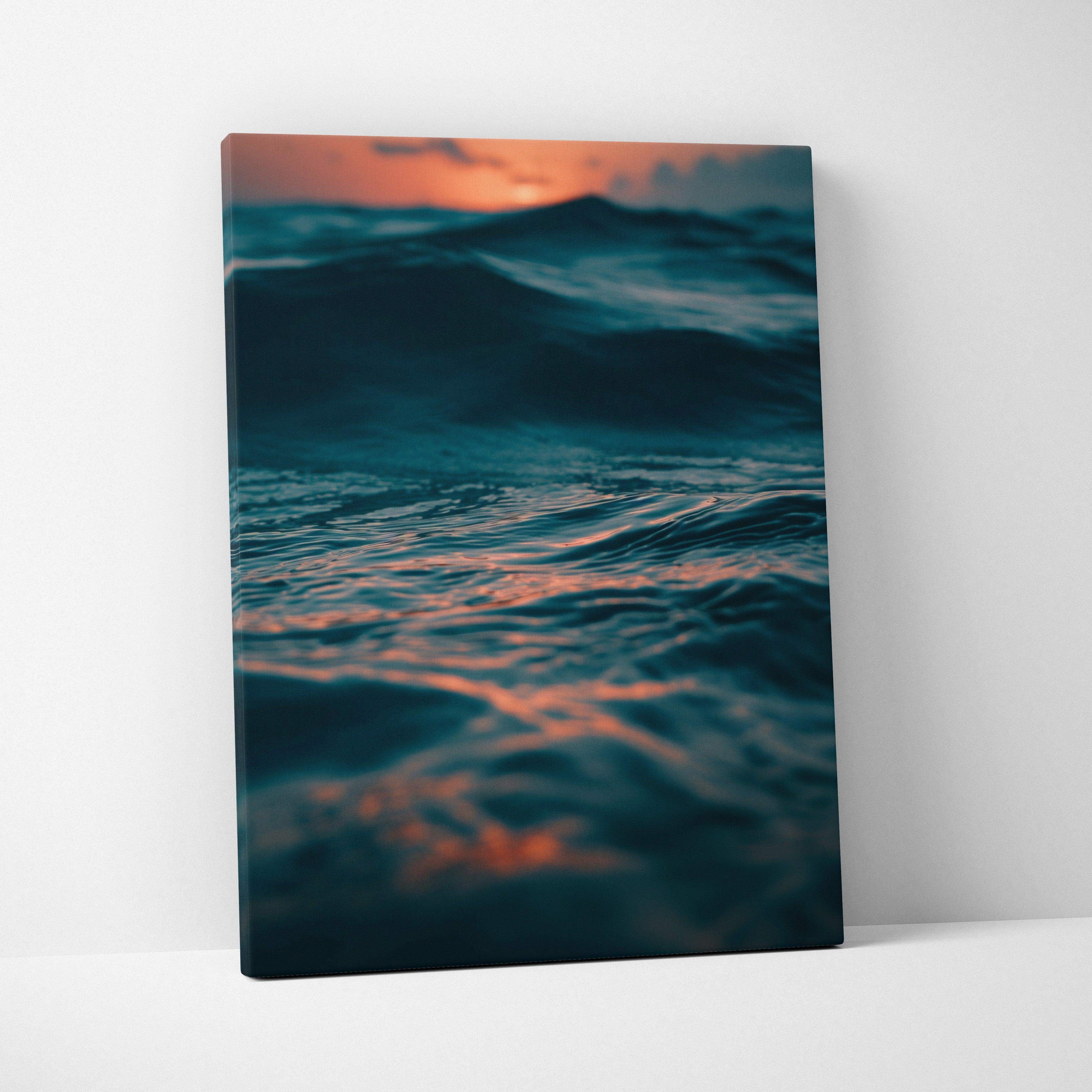 Canvas wall art featuring a serene ocean scene with deep waves and vibrant sunset hues.