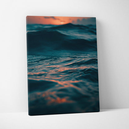 Canvas wall art featuring a serene ocean scene with deep waves and vibrant sunset hues.