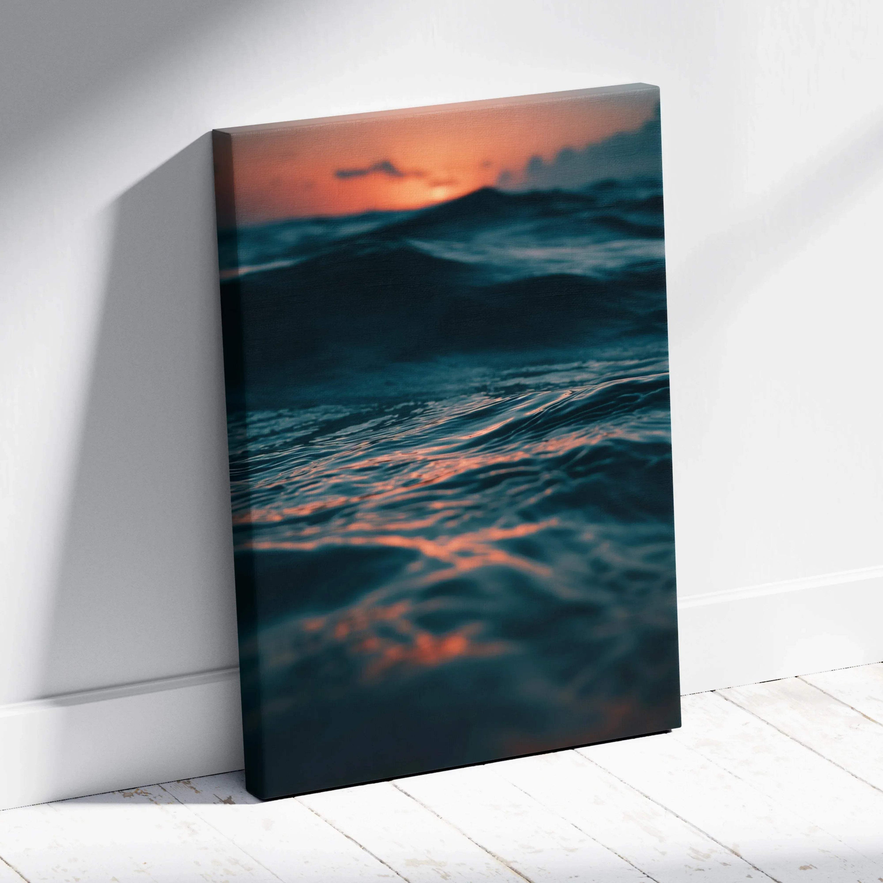 Ocean waves at sunset with deep blue and orange hues on canvas wall art.